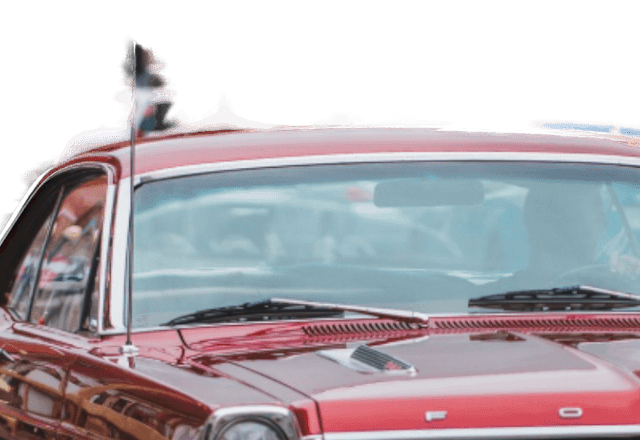 A close crop of the cut-out Fairlane's roofline: the thin radio aerial and the windscreen are surrounded by the transparency checkerboard