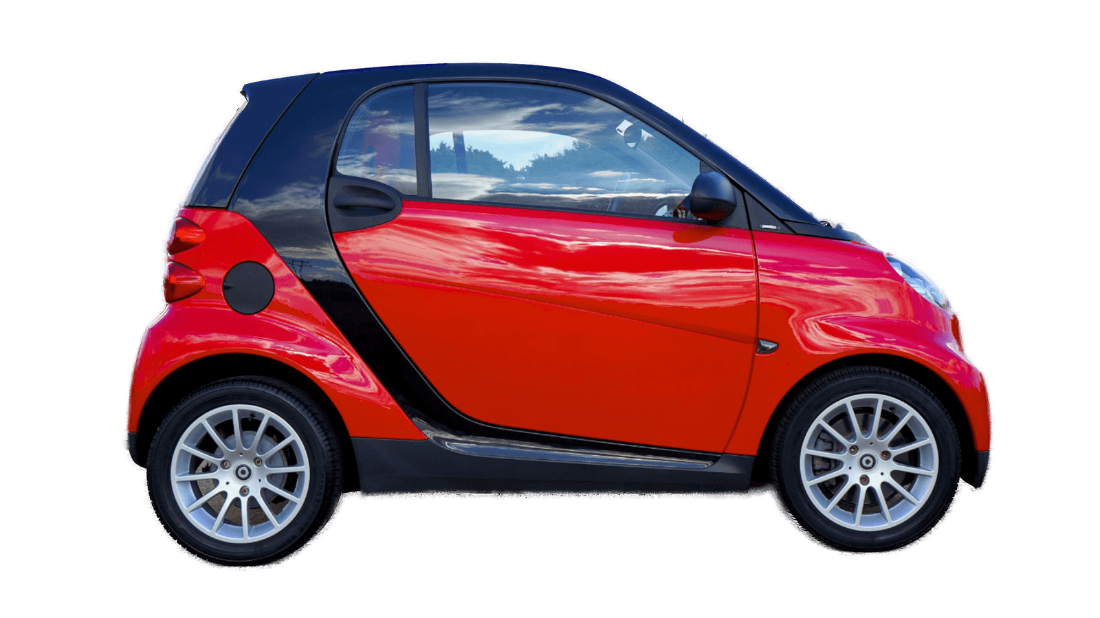 The same car cut out cleanly, with the transparency checkerboard showing through the wheel spokes and under the sills